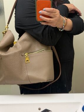 Authentic Louis Vuitton Melie Empreinte leather